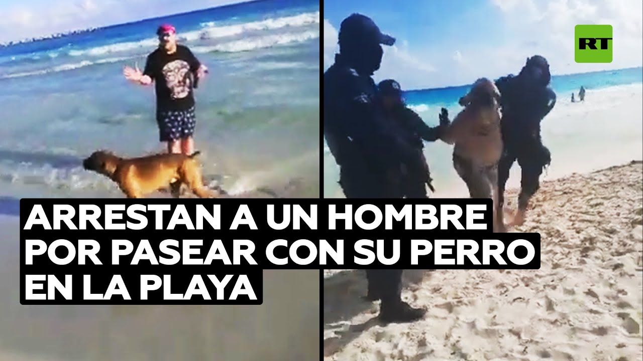 Policías reducen a un hombre que paseaba a su perro en una playa de Cancún