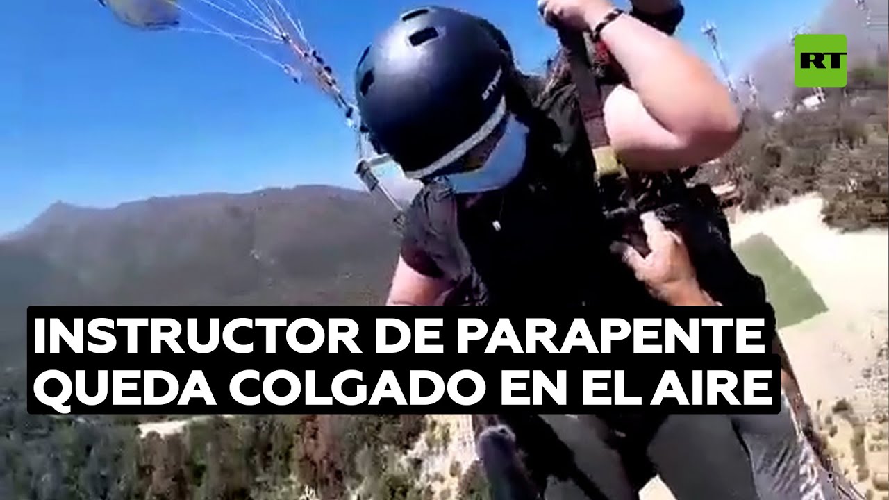 Instructor chileno queda colgado en un parapente sin arnés @RT Play en Español